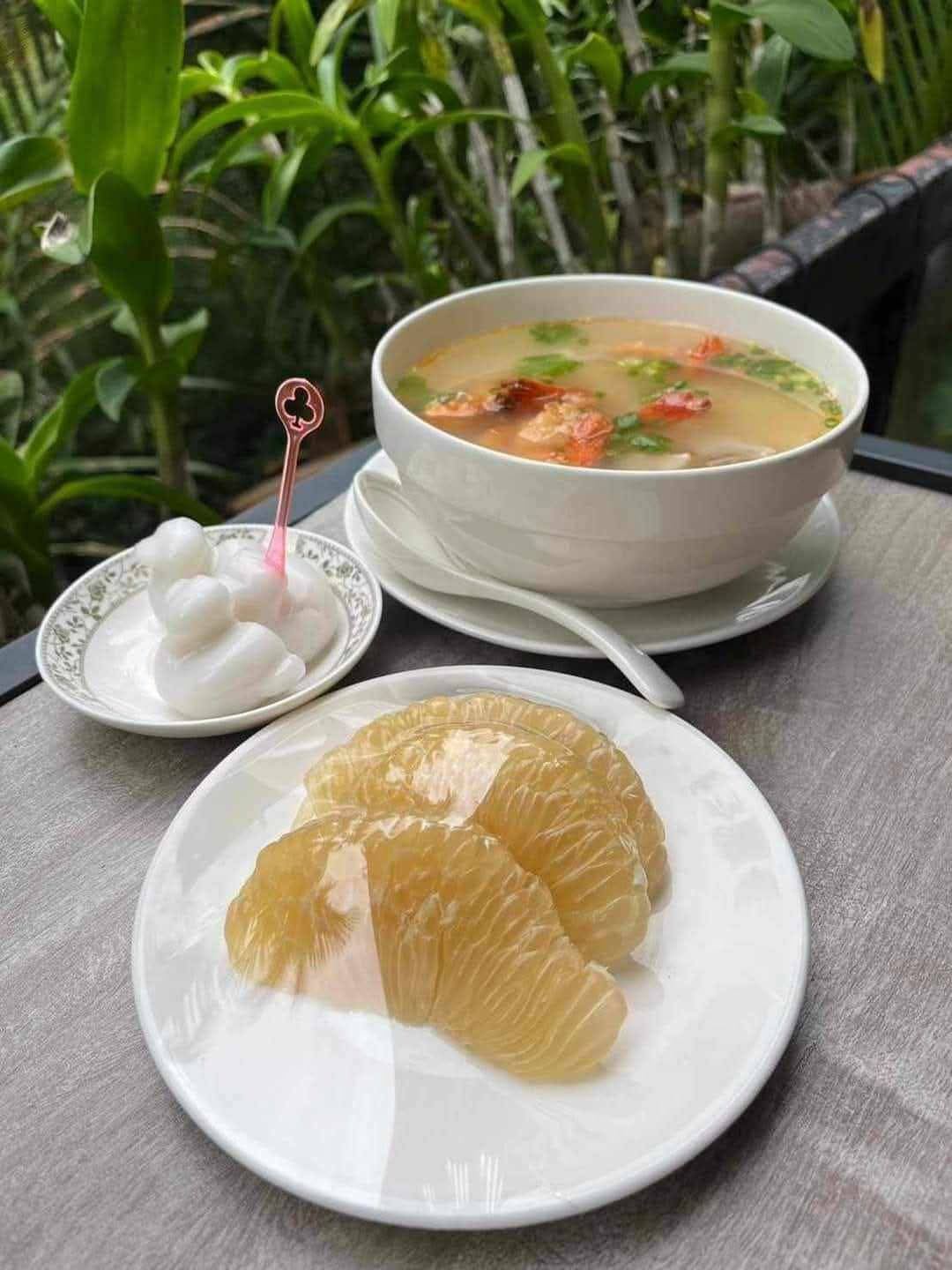 Thai soup, pomelo and coconut sweets served on the terrace