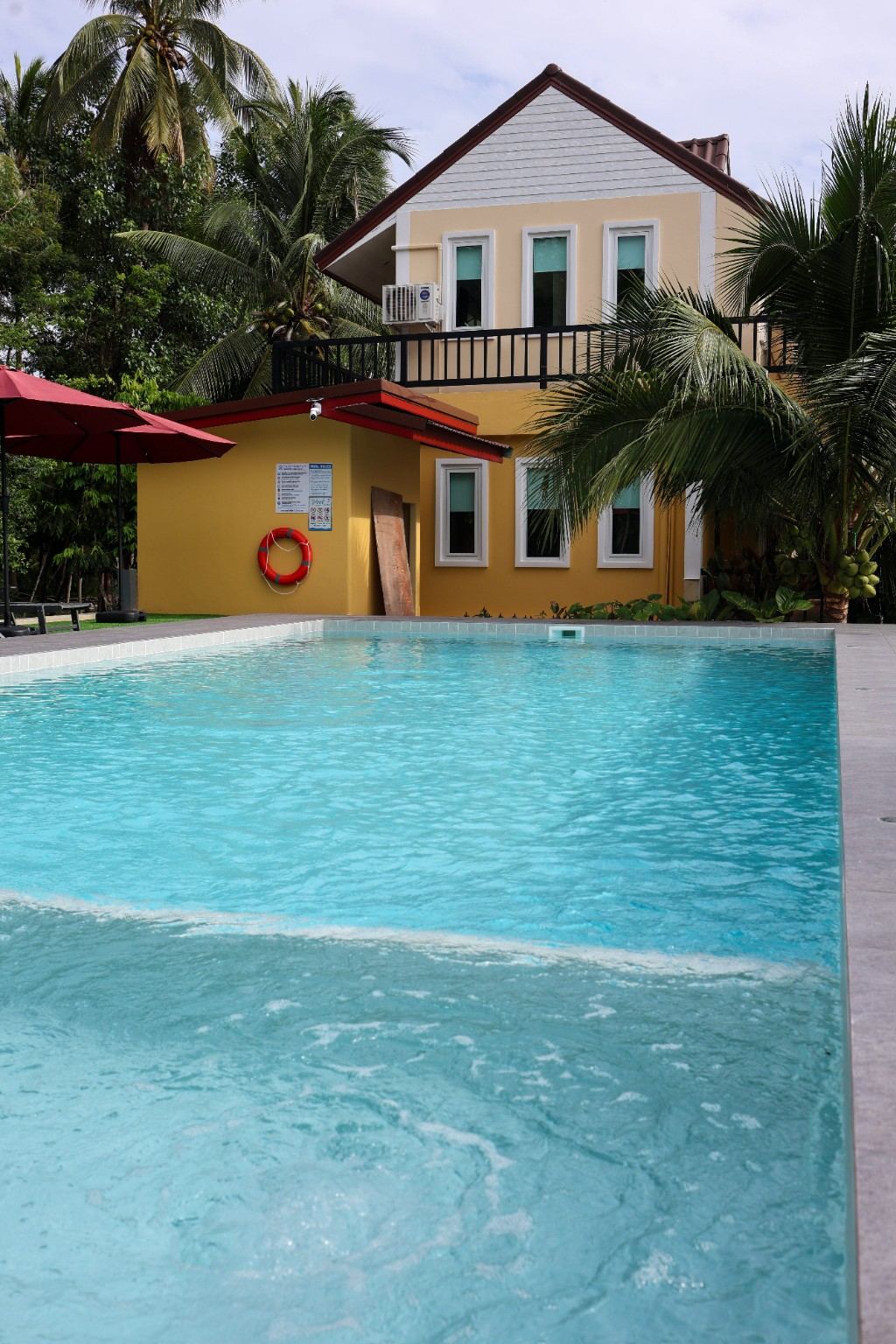 Pool and the yellow guest house